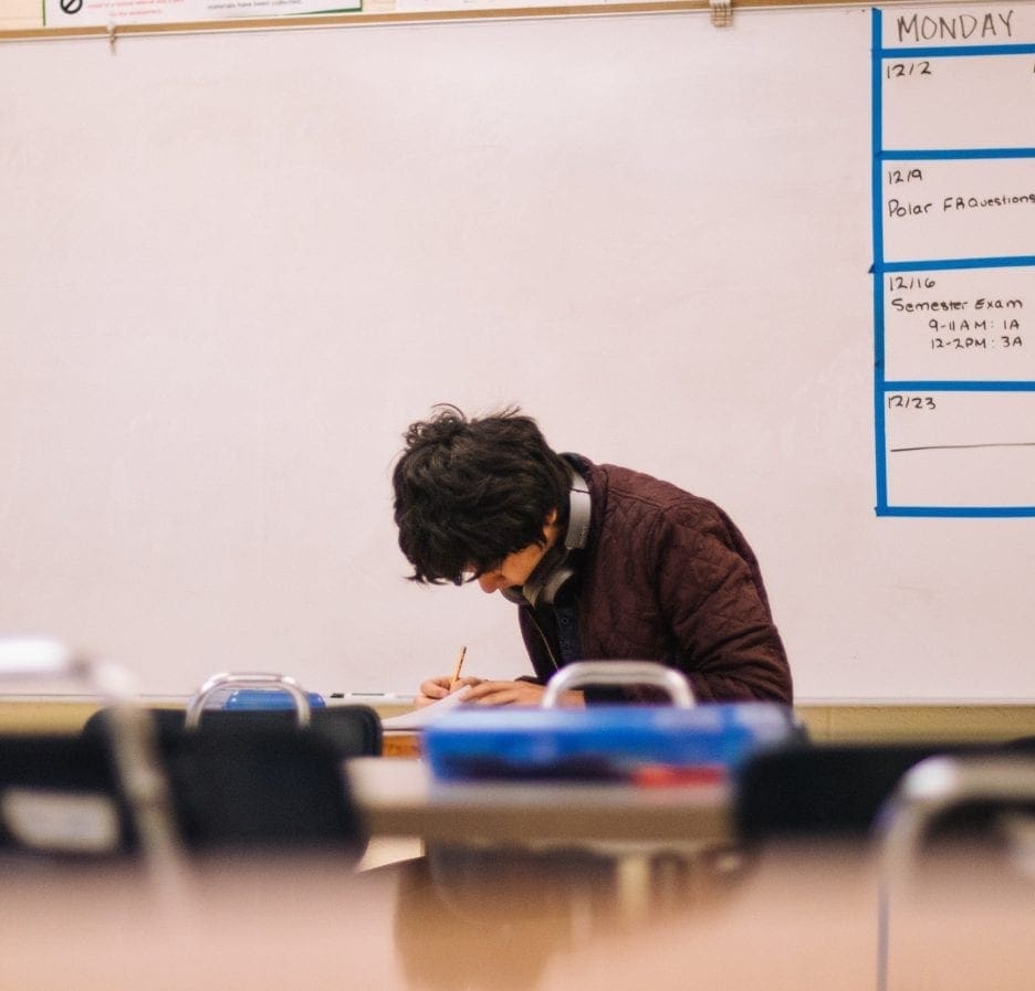 Man Writing on Table